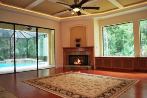 Fireplace Living Room with View of Outdoor Pool
